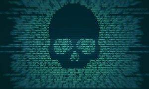 Green computer code forms the shape of a skull on a dark background, symbolizing hacking or a cyber threat. The image highlights cybersecurity risks as the skull emerges from blurred text, conveying the idea of digital danger or malware.